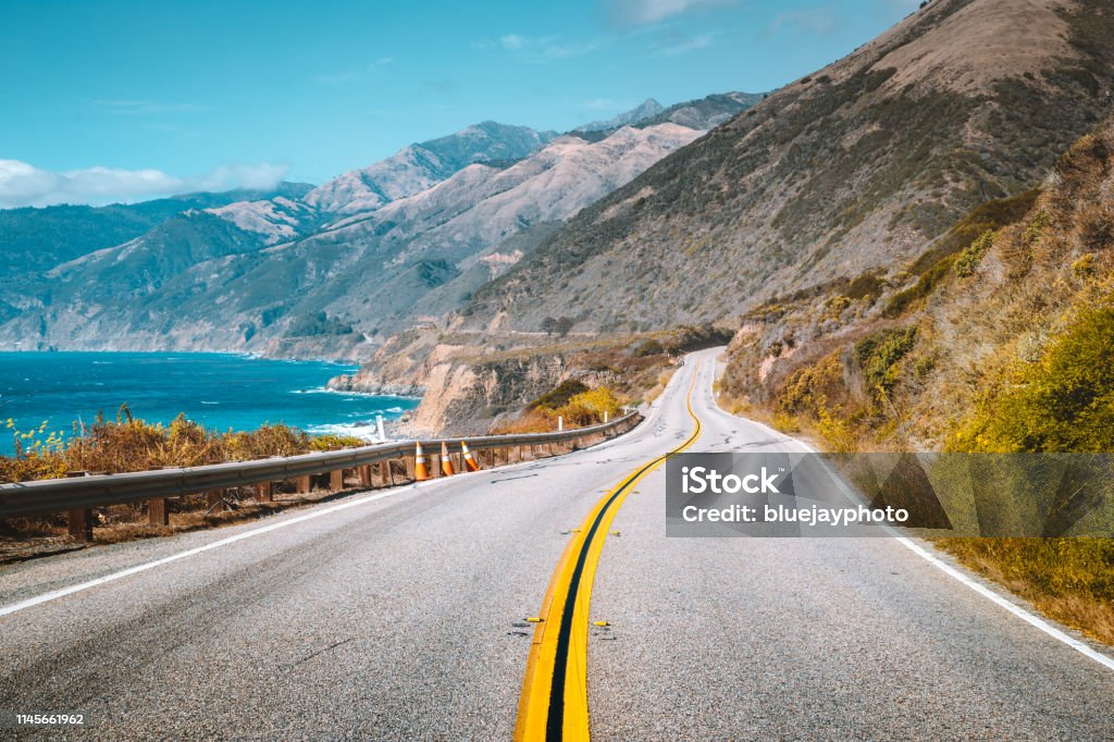 Famous Highway 1 at Big Sur, California Central Coast, USA Scenic view of world famous Highway 1 with the rugged coastline of Big Sur in beautiful golden evening light at sunset in summer, California Central Coast, USA Road Trip Stock Photo