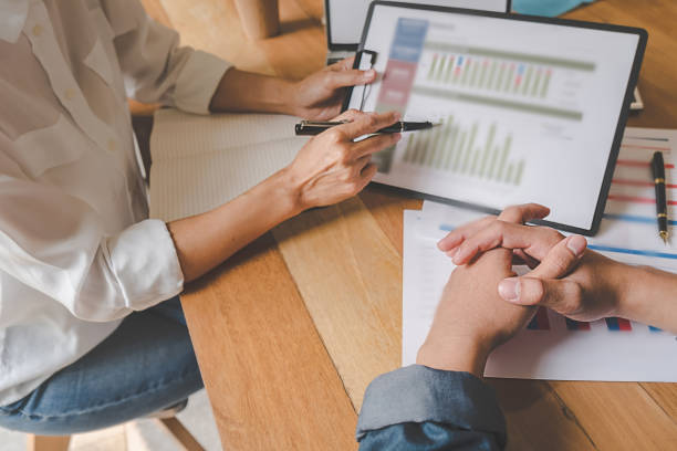 istock Business team brainstorming and discussing with financial data and report graph. Teamwork meeting working concept. 1145663566