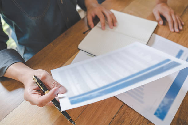 istock Business team brainstorming and discussing with financial data and report graph. Teamwork meeting working concept. 1145663608