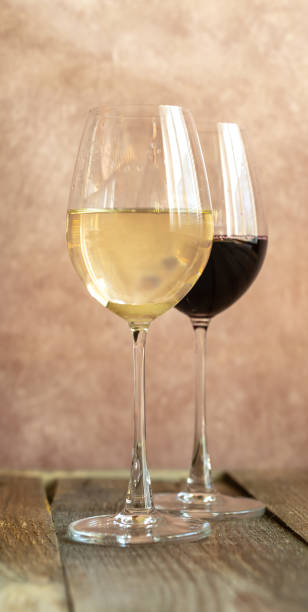 istock Glasses of white and red wine 1145663621