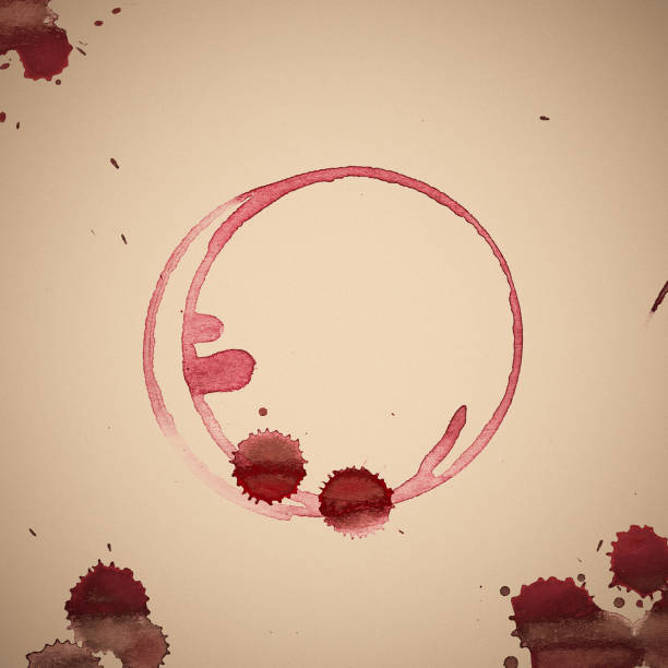 istock Red wineglass stains on sepia background 1145665353