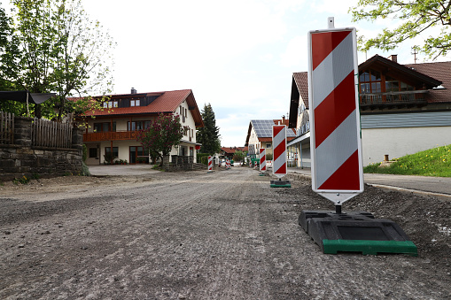 A construction site in a city. A road is being repaired