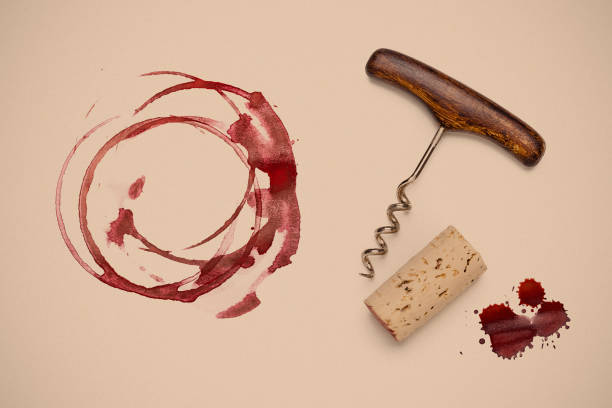 istock Red wine glass stains, corckscrew and wine cork stopper 1145669077