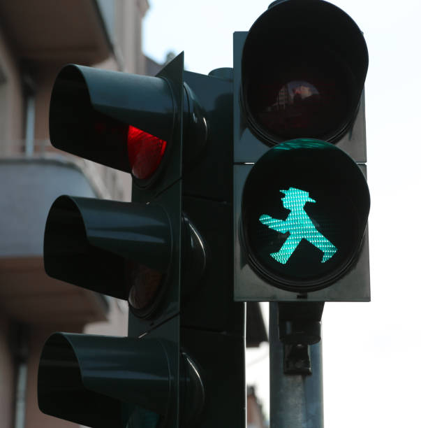 Ampelmann the symbol shown on Berlin, Germany - August 17, 2017: Ampelmann the symbol shown on pedestrian signals in Berlin. Green means ok to go ampelmännchen photos stock pictures, royalty-free photos & images