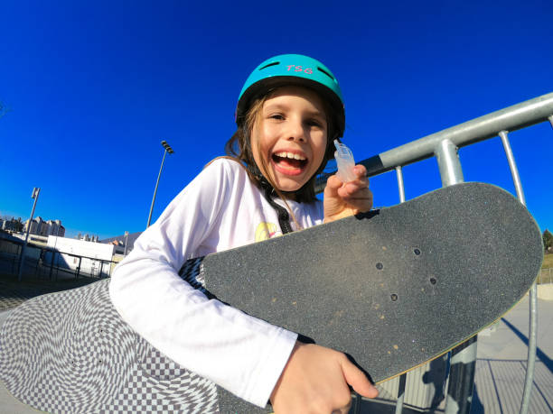 Little skateboarder portrait using a mouth guard Little skateboarder portrait using a mouth guard mouthguard stock pictures, royalty-free photos & images