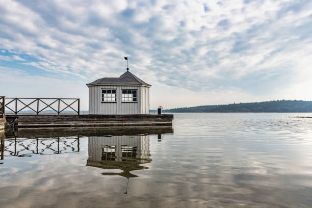 Sauna on a jetty Sauna on a jetty against dramatic sky swedish sauna stock pictures, royalty-free photos & images