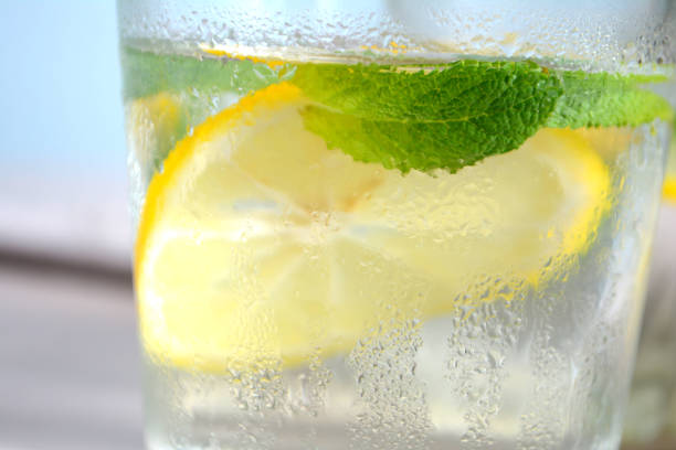 istock Cold refreshing lemonade with fresh mint and lemon in a glass Summer drink 1145671613