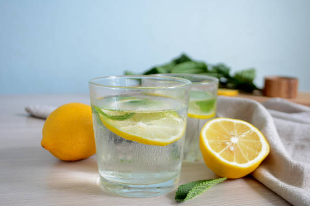 istock Cold refreshing lemonade with fresh mint and lemon in a glass Summer drink 1145672779