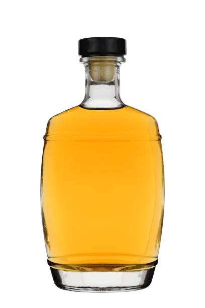 istock Glass bottle filled with brandy or whisky with a stopper isolated on a white background 1145672962