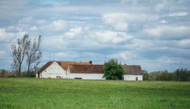 istock Rustical building with spring meadow and nice cloudy sky, Czech republic 1145674212