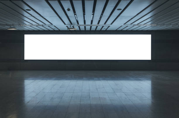 istock blank billboard white screen LED horizontal advertising banner board indoor in subway station ad interior public hall. 1145675377