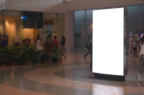 istock blank billboard white screen LED vertical advertising banner board indoor in subway station ad interior public hall. 1145675393