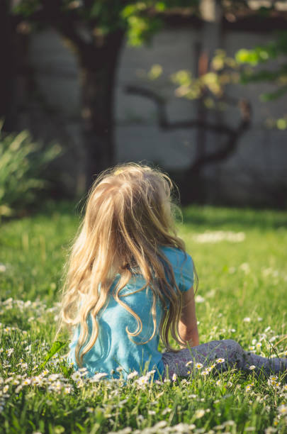 istock girl with long blond hair 1145675794
