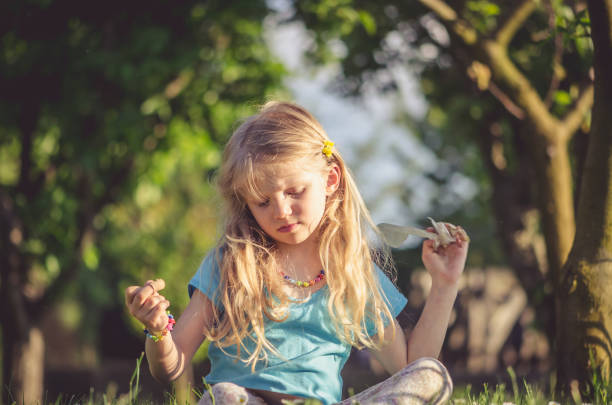 istock girl with long blond hair 1145675971
