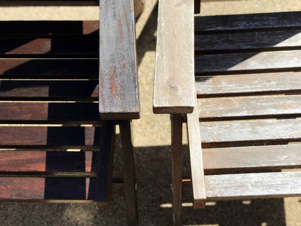 Staining wood patio furniture before and after stock photo