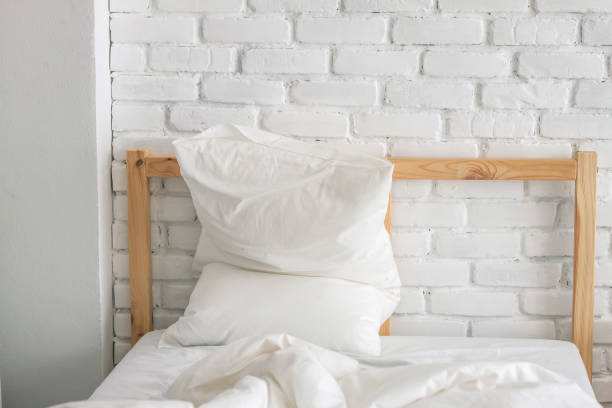 istock a white piilow and blanket messed up 1145679919