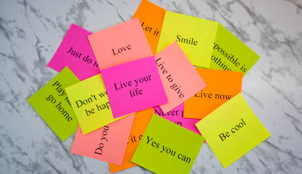 istock Motivational words on colorful stickers on a marble table. Business plan, strategy, concept, future. Copy space, creativity, project, art. Vision board. 1145682954