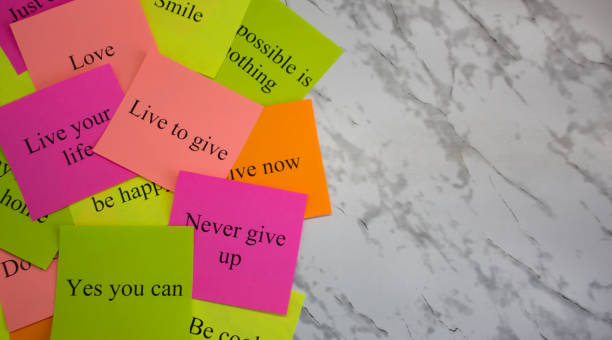 istock Motivational words on colorful stickers on a marble table. Business plan, strategy, concept, future. Copy space, creativity, project, art. Vision board. 1145682974