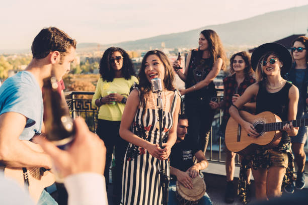 istock Friends drinking and partying on the rooftop 1145683127