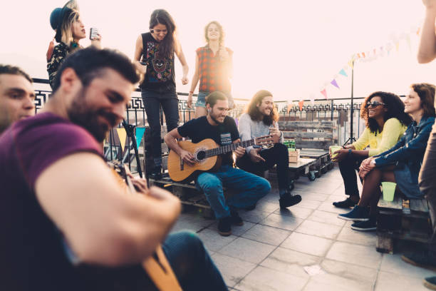 istock Friends drinking and partying on the rooftop 1145683261