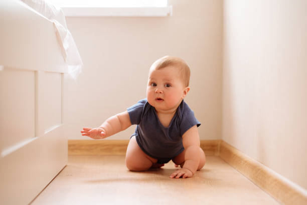 istock crawling funny baby boy indoors at home 1145684614