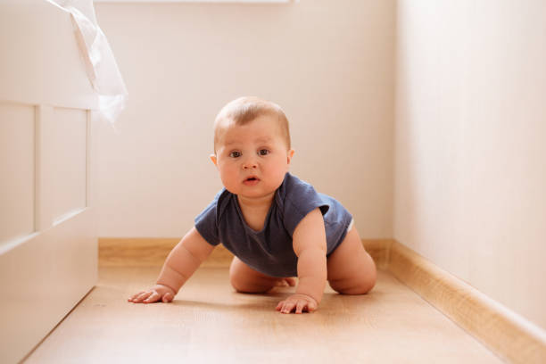istock crawling funny baby boy indoors at home 1145684623