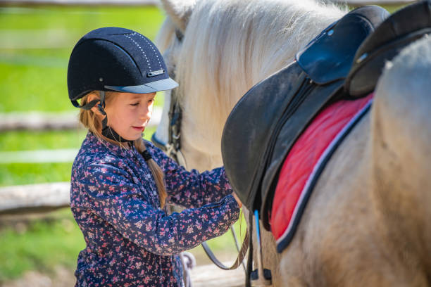 istock Girl with her horse 1145686242