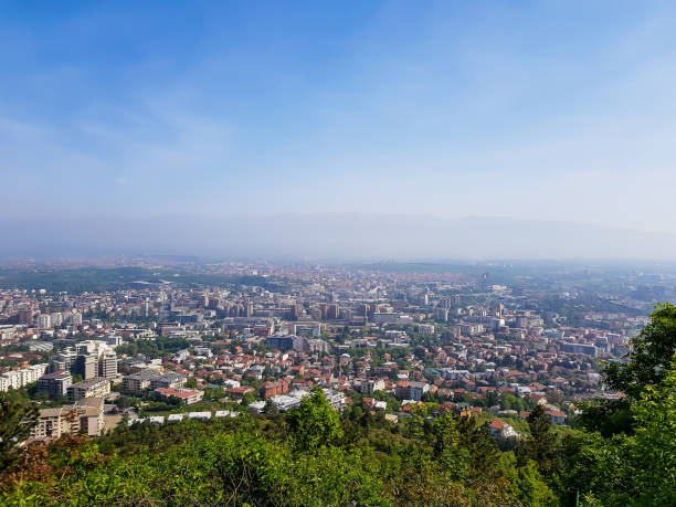 istock City landscape with trees in foreground on a sunny day 1145686551