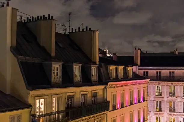 Roofs of houses at night. Paris, France.