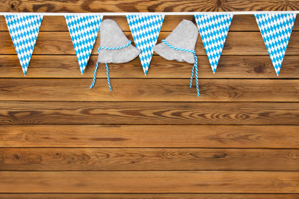 Bavarian flags and wooden background with copy space