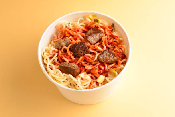 istock Paper cup with instant ramen noodles with beef and vegetables. 1145691446