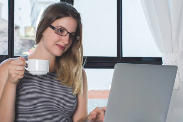 istock Woman working on laptop at home. 1145691683