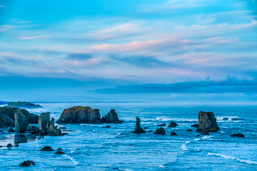 Sunset on Sea stack formations off the town of Bandon Beach on the Oregon Coast