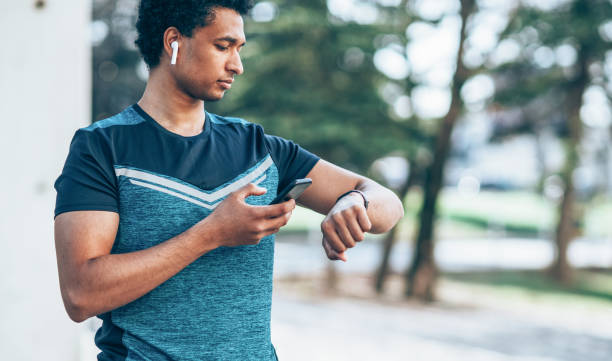 istock Male athlete with smart phone 1145692649