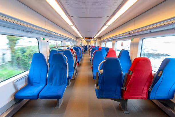 istock Empty interior of a train carriage with the red and blue seats 1145692919