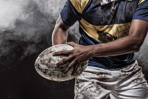 A bloody, dirty Rugby Player posing for an individual image