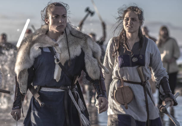 istock Viking warriors in action on a beach at the water's edge 1145694129