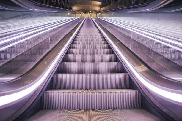 Photo of Modern Escalator Point of View from Bottom