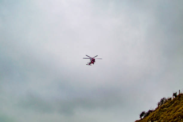 istock Helicopter flying in the blue sky on a mission in dover uk 1145699651