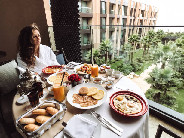 istock woman at the table for the buffet breakfast with fruit 1145700107