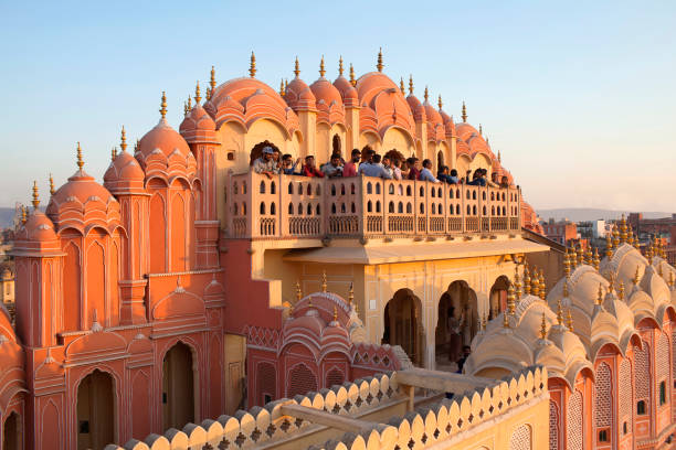 Hawa Mahal, Palace of Winds in Jaipur, Rajasthan state, India Jaipur, India - January 3, 2019: Tourists walking on the top of famous ancient Hawa Mahal, Palace of Winds in Rajasthan state hawa mahal photos stock pictures, royalty-free photos & images