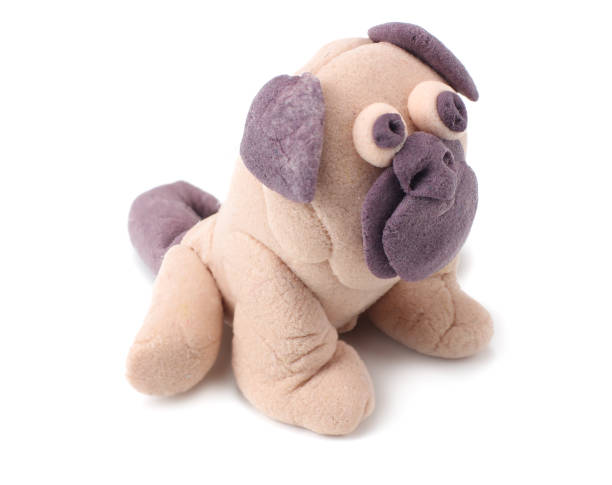 istock plasticine pug dog isolated on white background. modelling clay 1145703845