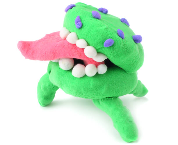 istock green plasticine burger monster isolated on white background. modelling clay 1145703848