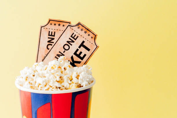 istock Movie tickets and popcorn on blue background. Copy space for text 1145704925