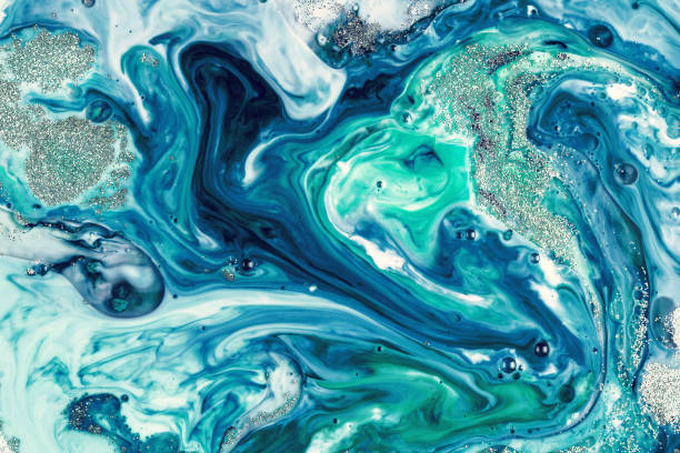 istock Abstract background of ink paint swirls over liquid 1145705412