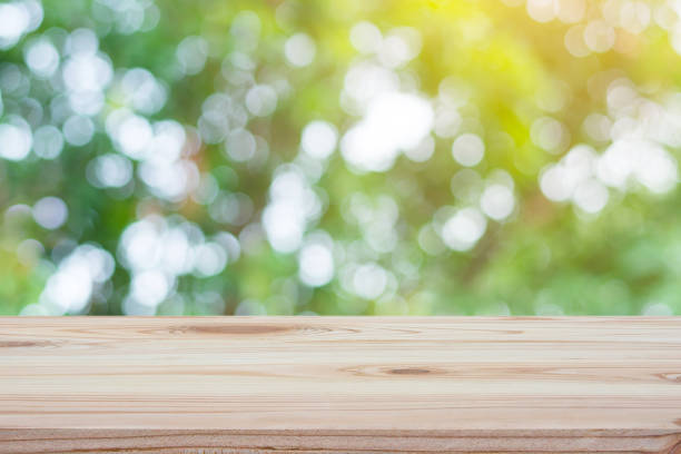 istock Empty wood table top and blur nature background with copy space for display or montage your products 1145707317