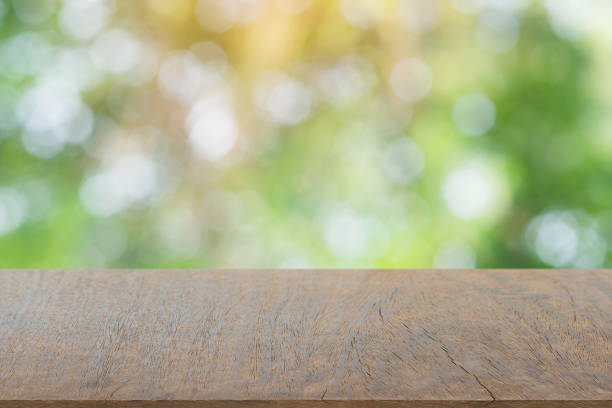 istock Empty dark wood table top and blur nature background with copy space for display or montage your products 1145707483