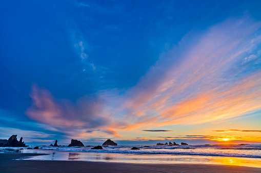 Sunset on Sea stack formations off the town of Bandon Beach on the Oregon Coast