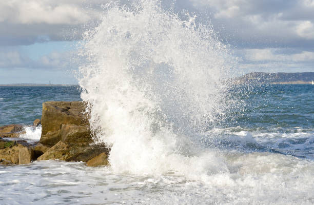 Waves impact onto rocks off the Irish coast. stock photo