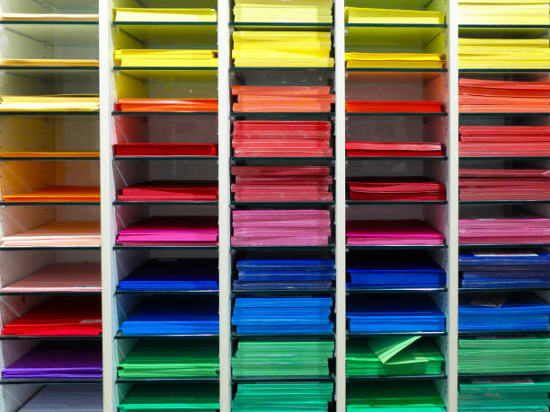 Shelf with many professional colorful sheets of paper for artists. stock photo